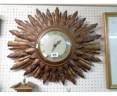 A 56cm vintage Smiths Sectric ornate gilt sunburst wall timepiece - sold as a collector's item only - some damage to rays