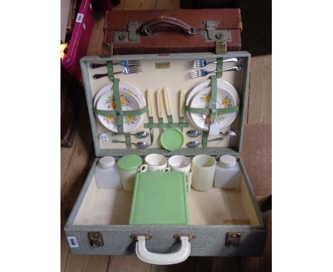 A vintage Brexton picnic case with ceramic plates and cups - sold with a small leather case