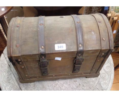 A 38cm reproduction stained mixed wood dome-top trunk with leather straps and flanking drop handles