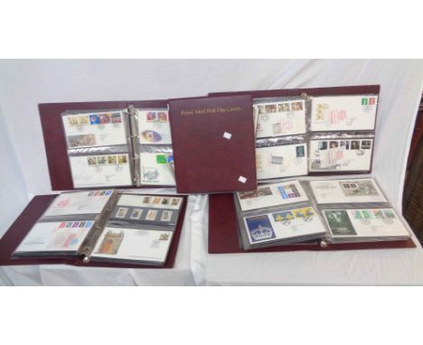 Five Royal Mail First Day Covers albums containing late 20th Century GB and Northern Ireland FDCs - many with related mint st