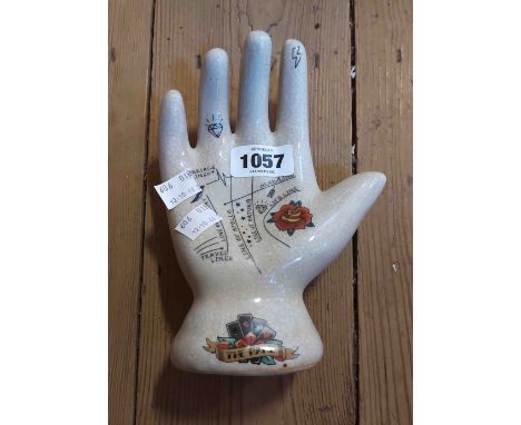 A modern ceramic palmistry hand with crackle glaze finish