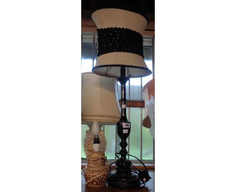 A small pottery table lamp - sold with a tall ebonised table lamp with shade and a quantity of plates