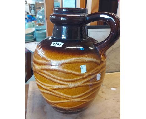 A large mid 20th Century West German pottery vase of globular jug form with slip trailed decoration on a light and dark brown
