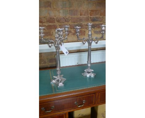 A pair of three light silver plated empire style candelabra