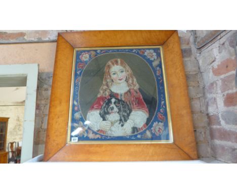 A Victorian needlepoint woolwork portrait in a maple frame - frame size 75cm x 73cm