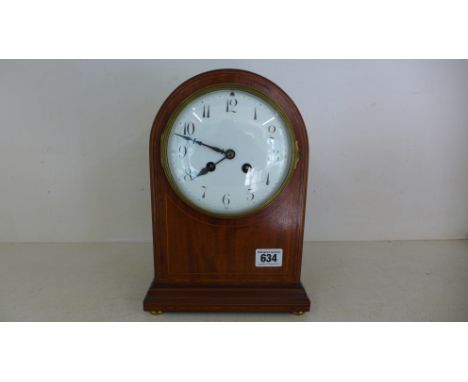 A French mahogany and line inlaid mantle clock with white enamel dial, Arabic numerals to chapter ring