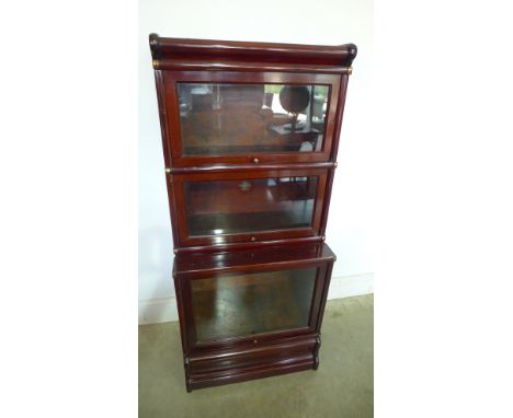 An unusual slim Globe Wernicke mahogany stacking bookcase with three sections - Height 126cm x 56cm x Depth 36cm