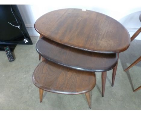 A nest of three Ercol pebble tables