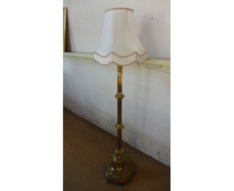 A telescopic brass standard lamp and shade in working order