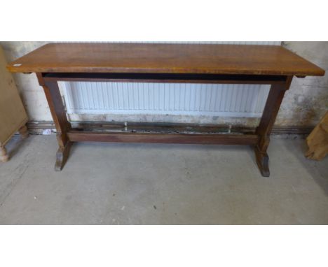 An interesting oak trestle table with an under shelf - Height 76cm x 160cm x 53cm