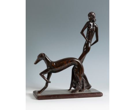 Female figure with dog in the style of KARL HAGENAUER (1898-1956), 20th century.Patinated wood.Measurements: 42 x 34 x 12 cm.