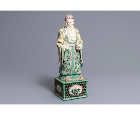 A large Chinese verte biscuit figure of an immortal on reticulated stand, Kangxi H.: 48 cm---------Please request condition r