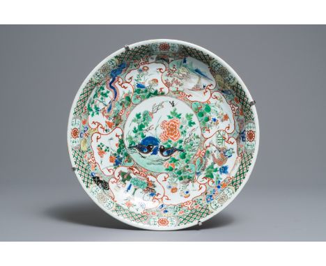 A Chinese famille verte dish with birds and mythical animals, Kangxi Dia.: 35 cmÊ Provenance: With a label on the back for th
