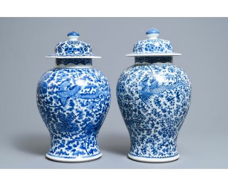A near pair of Chinese blue and white 'phoenix' vases and covers, Kangxi H.: 44,5 cm---------Please request condition reports