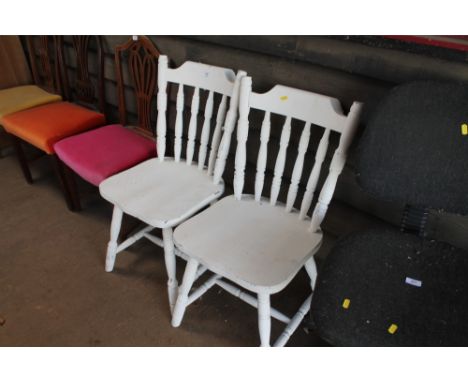 Two white painted stick back dining chairs 