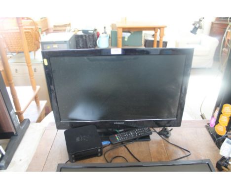 A Polaroid flat screen television with remote control and Sky Hub box