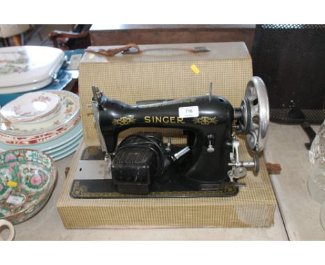 A Singer sewing machine in fitted case, sold as collector's item