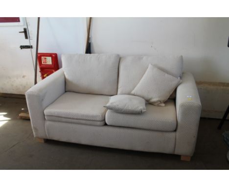 A modern cream upholstered sofa bed 