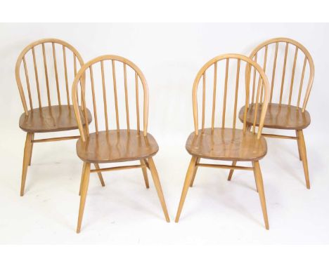 A set of four Ercol light elm stickback kitchen chairs, each on turned slightly tapering supports, w.42cm Each structurally s