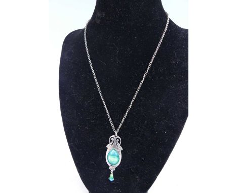 In the style of Archibald Knox - an Art Nouveau silver and enamel pendant, of interlaced stylised and slightly elongated form