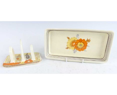 A 1930s Clarice Cliff Capri pattern pottery twin toast rack, typically bright colour painted, black printed backstamp verso, 