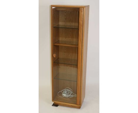 An Ercol 'Windsor' range light elm narrow display cabinet, with single glazed door and four adjustable glass shelves, wired f