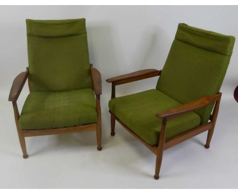 Guy Rogers, a pair of 1960s teak Manhattan armchairs, each with slightly shaped and curved arm rests, green fabric upholstere