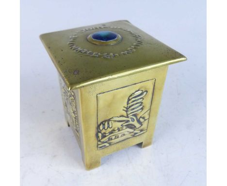 An Arts &amp; Crafts brass and cabochon enamel inset square tea caddy, the hinged cover with central cabochon titled 'The Sto