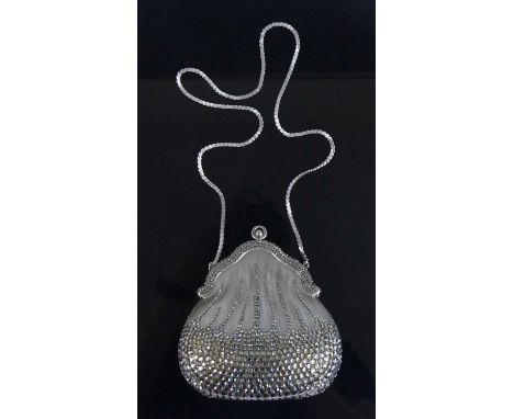 Judith Leiber - a sequinned lady's evening bag, with linked shoulder strap, button clasp, and of bombe form, embossed 'Judith