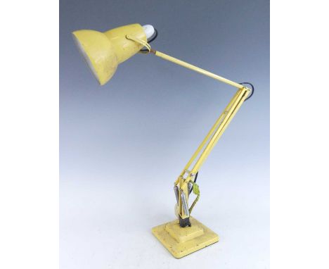 Herbert Terry - a yellow painted metal anglepoise lamp, model No.1227, of hinged and rotating form with movable shade, raised