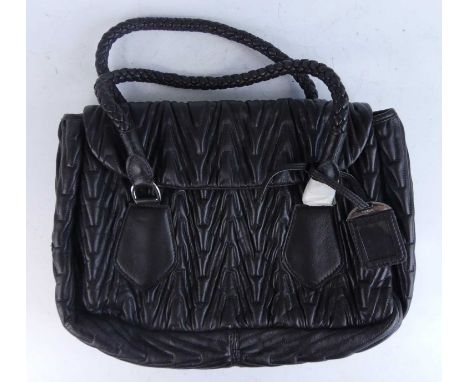 Prada - a Rame colour Bauletto leather handbag, with raised stylised padded stitched outer detail, twin interlaced shoulder s