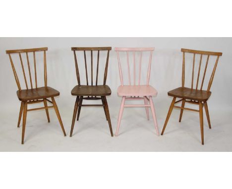 A set of four 1960s Ercol model 391 stick back kitchen chairs, two light elm, one later pink painted, and one in darker varia