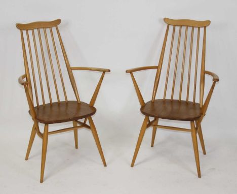 A pair of Ercol light elm Goldsmith dining elbow chairs, width 61.5cm