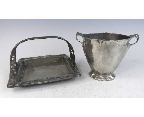 An Art Nouveau Kayserzinn pewter square single handled tray, with stylised handle and raised leaf and berry decorated border,