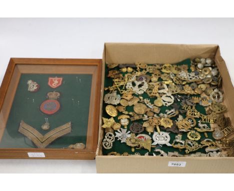 Approximately one hundred military cap badges, buttons and shoulder titles including King's Own Scottish Borderers, The Borde