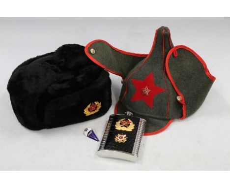 Soviet Russian winter hat with enamelled badge, a replica green cloth peaked hat, a Soviet hip flask as new and a Cuban Airbo