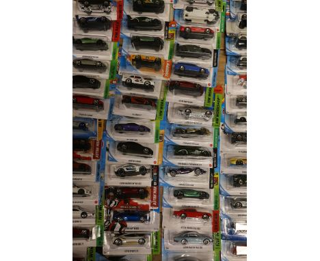 Approximately one hundred and thirty Mattel Hot Wheels diecast model vehicles, each carded. ref#Box13 (130) 