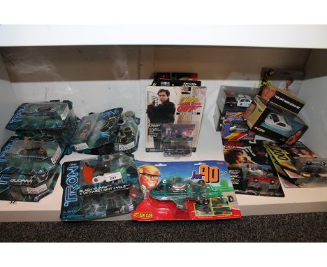 Shelf of collectibles to include seven boxed Tron Legacy figures comprising of Black Guard Vintage Light Cycle, Clu's Light C