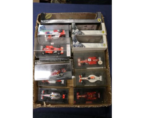 Sixteen 1:43 scale model vehicles to include  Hotwheels Racing 55602 Ferrari 2001 Constructors Champions, 248 F1 Michael Schu