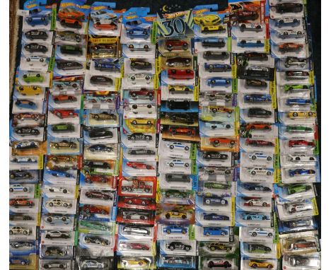 Approximately one hundred and thirty Mattel Hot Wheels diecast model vehicles, each carded. ref#Box31 (130) 