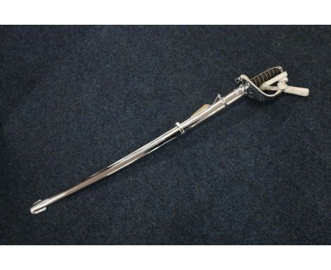 British cavalry troopers sword, the etched blade with ricasso marked for Wilkinson Sword, the spine stamped '123823 WS arrow 