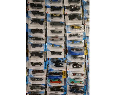 Approximately seventy-eight Mattel Hot Wheels diecast Batman themed model vehicles, each carded. ref#Box7 (78) 