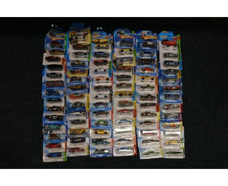 Approximately eighty Mattel Hot Wheels diecast model vehicles, each carded. ref#Box9 (80) 