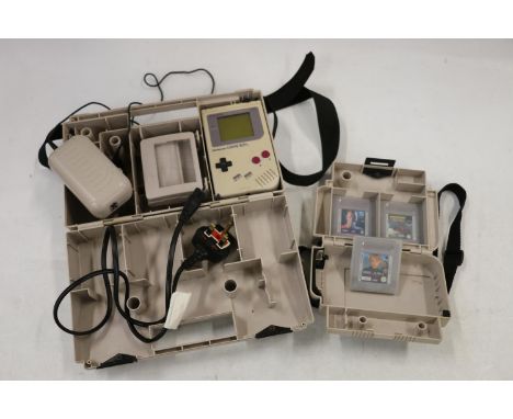 Nintendo Gameboy model DMG-01 1989 with games including Jurassic Park, Terminator 2, Home Alone 2 and Ferrari Grand Prix Chal