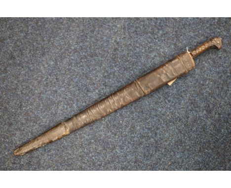 Afghan Kyber sword or charay having tapering T form blade and carved wood grip, blade length 53cm, sword length 69cm, with le