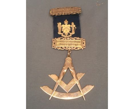 9ct gold Masonic jewel in the form of a compass and square 17g on a blue ribbon with mounts 'Presented to Brother G G Elliot 