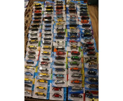 Approximately one hundred Mattel Hot Wheels diecast model vehicles, each carded. ref#Box15 (100) 