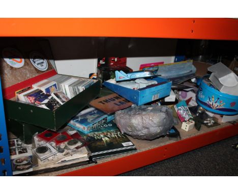 Shelf of collectibles and toys including a box file of trading cards, Corgi models and other diecast, also commemorative coin