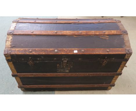 A wood bound dome top trunk 61cm high x 91cm wide x 53cm deep Condition Report: Available upon request