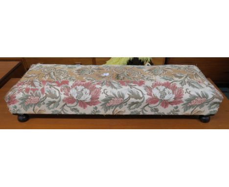A 20th century tapestry upholstered footstool, modern red ground eastern style rug and another blue ground rug with central m